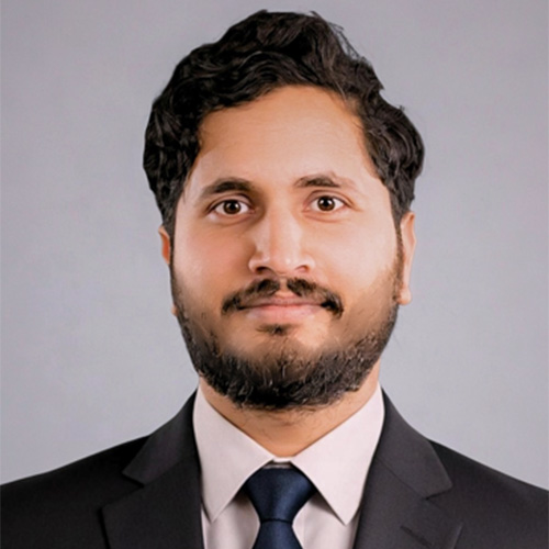 Assistant professor Shivam Chaturvedi in a dark suit and tie